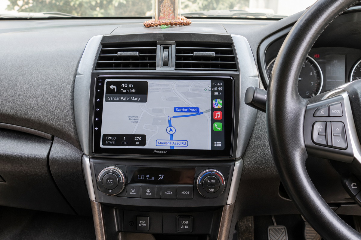 Car dashboard with a 9-inch Pioneer touchscreen stereo showing Apple CarPlay navigation.