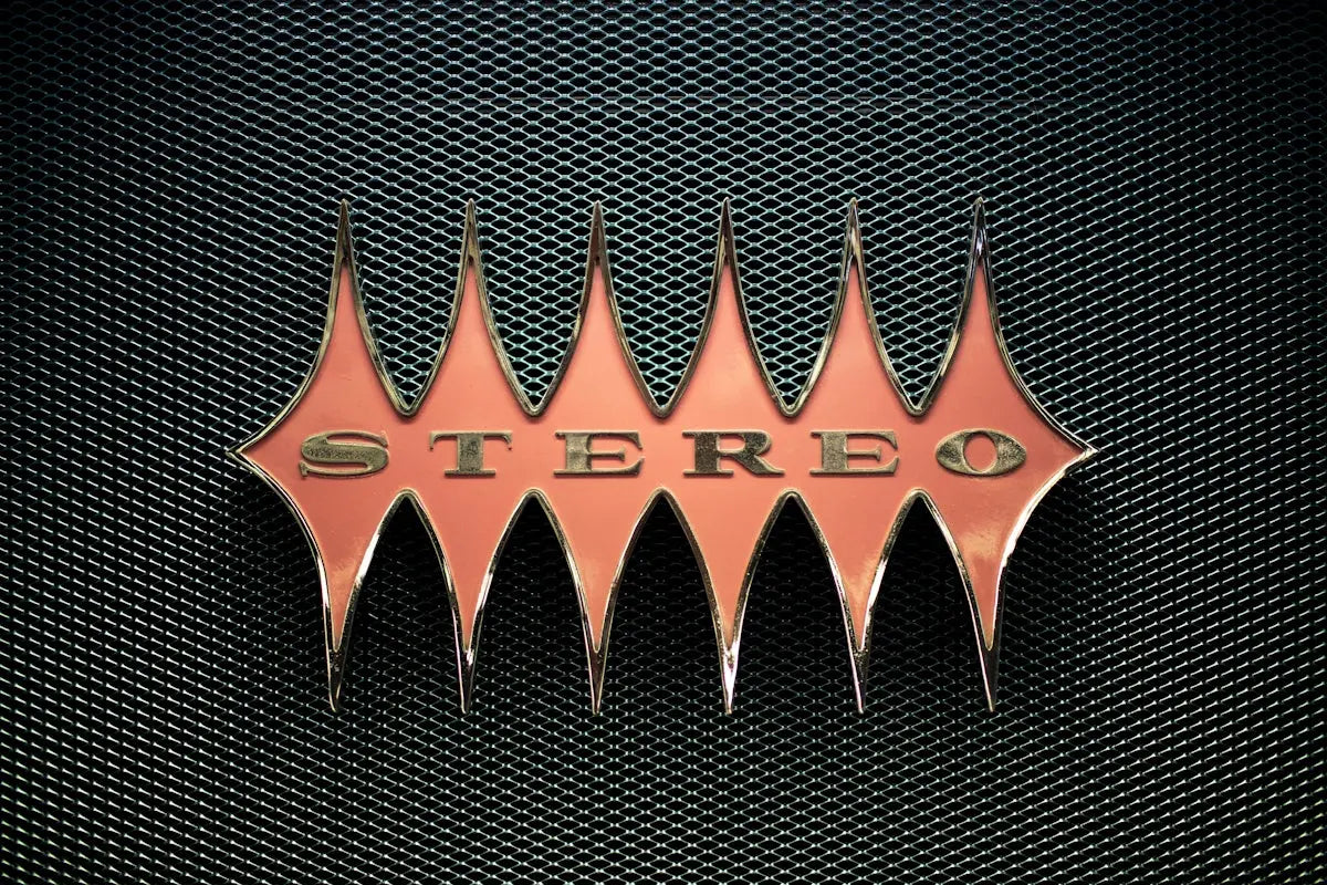orange stereo emblem on mesh surface