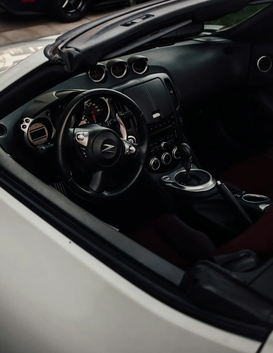 a close up of a car dashboard with a steering wheel