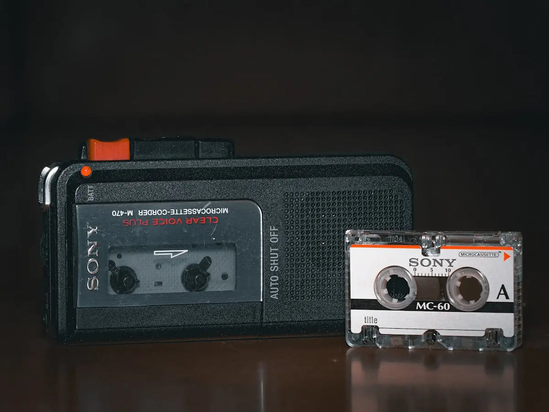 An old radio and a cassette player sitting on a table