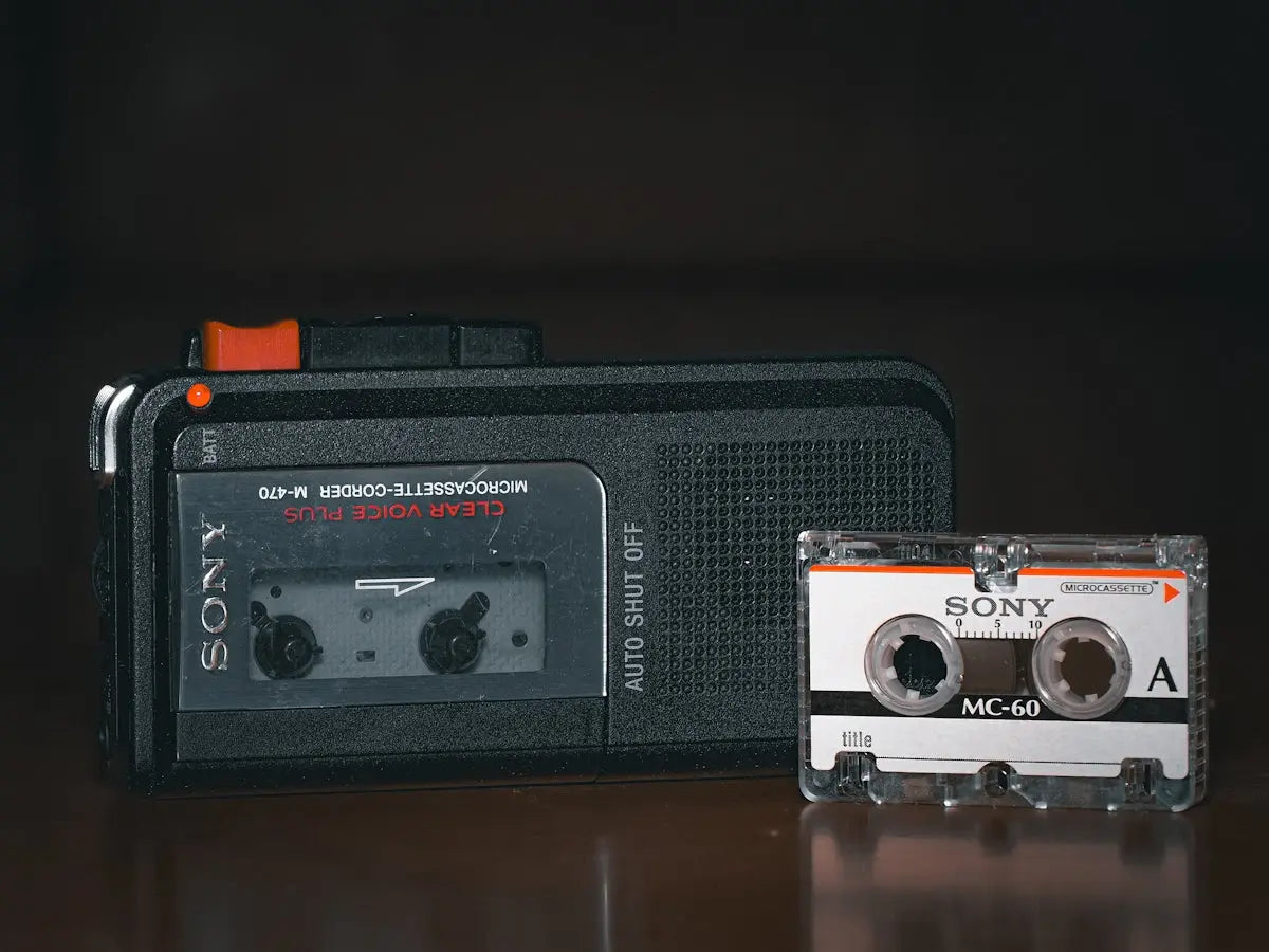 An old radio and a cassette player sitting on a table