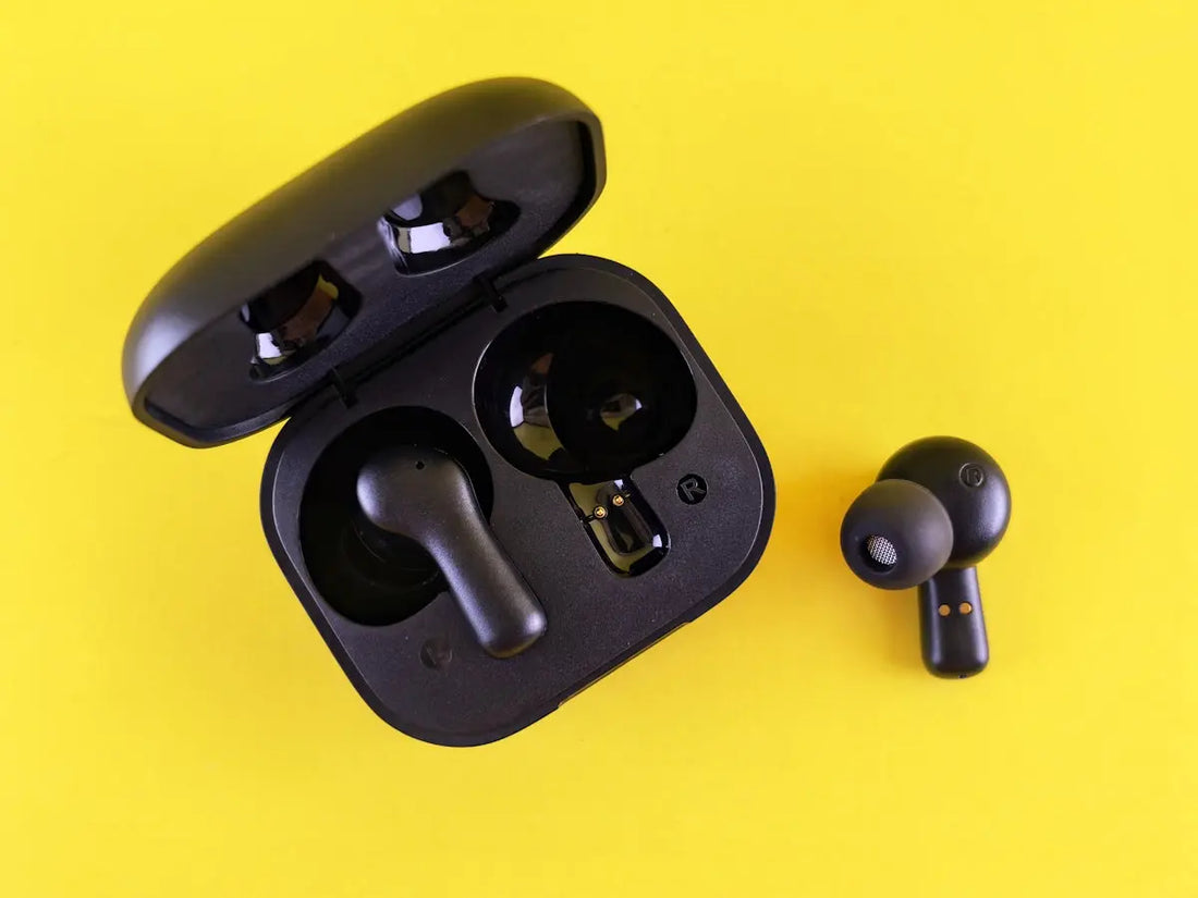Black earbuds and their charging case.