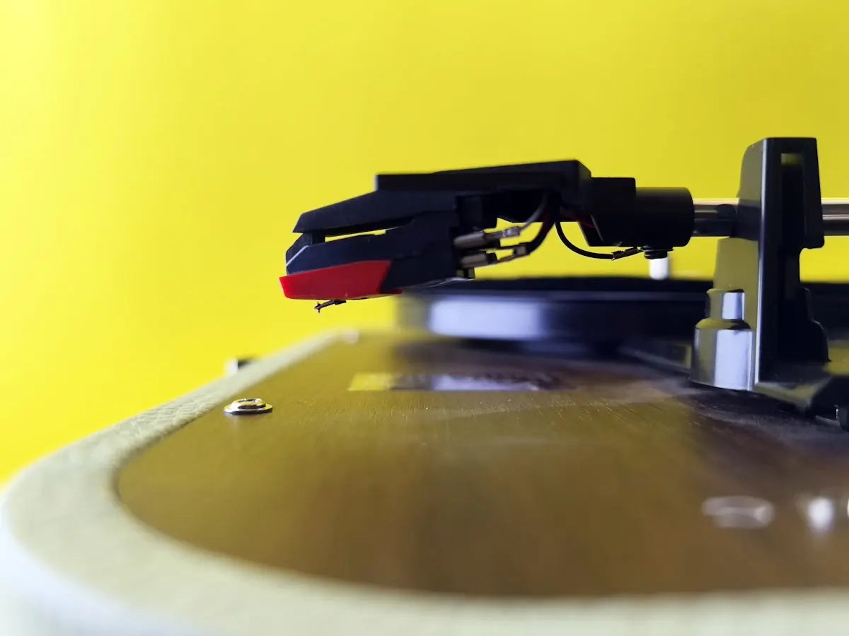 A turntable's needle is ready to play.