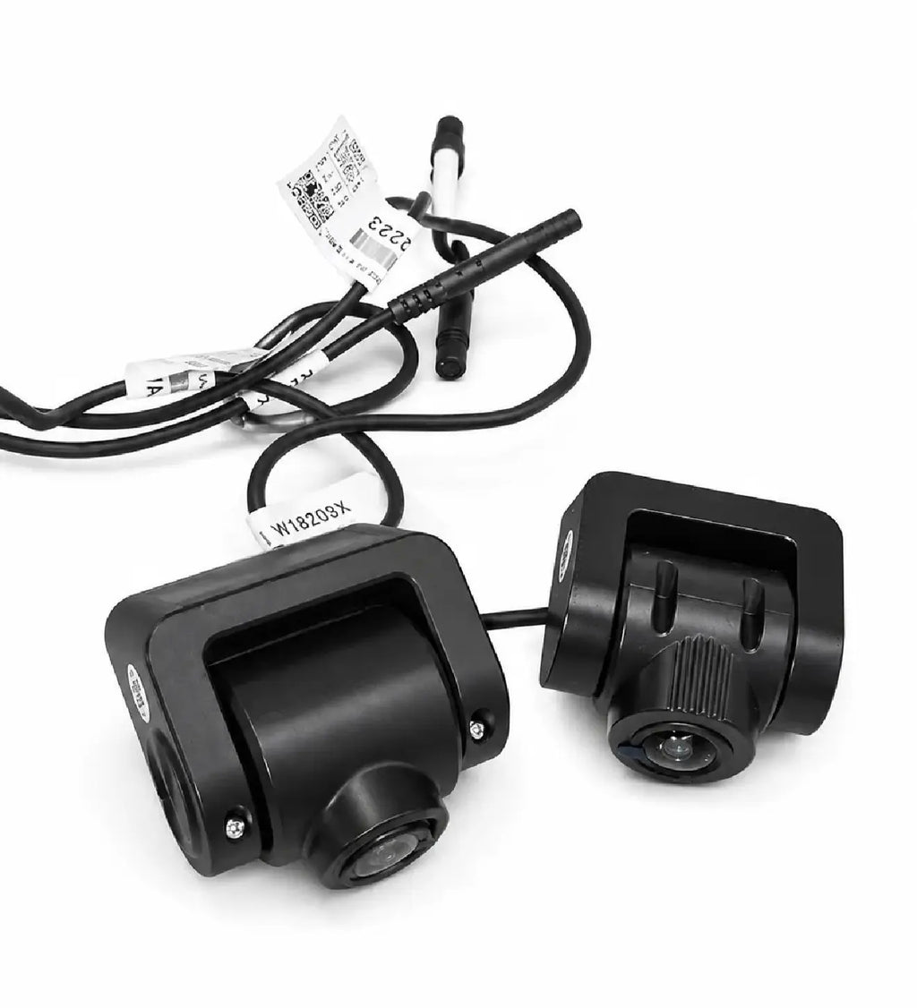 Two black rear cameras with lenses, mounting bases, and bundled cables