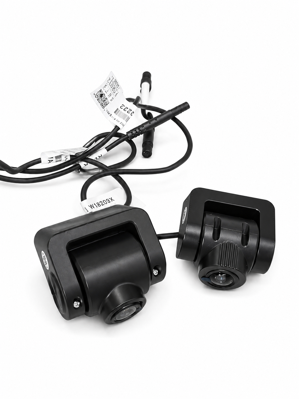 Pair of black dash cameras with mounting brackets and wiring harness