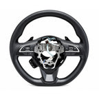 Multi-function black steering wheel for Maruti Suzuki Fronx, featuring paddle shifters and integrated audio controls.